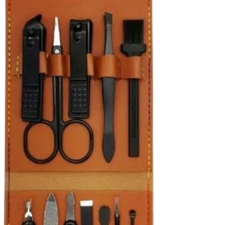 Manicure set with tools in a brown leather case on a white background